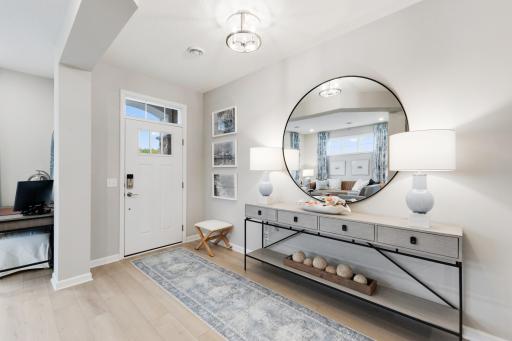 A spacious entry with a bright flex room right there. *Model home photos, many options to choose on this to be built home.*