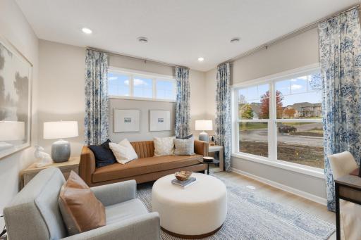 The flex room at the front of the home is spacious and would make a great sitting room, library, music room, etc., the possibilities are endless. *Model home photos, many options to choose on this to be built home.*