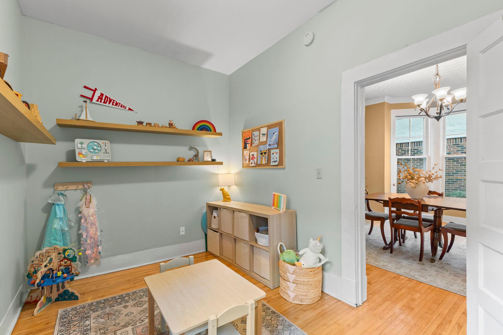 Main floor bedroom currently used as play room