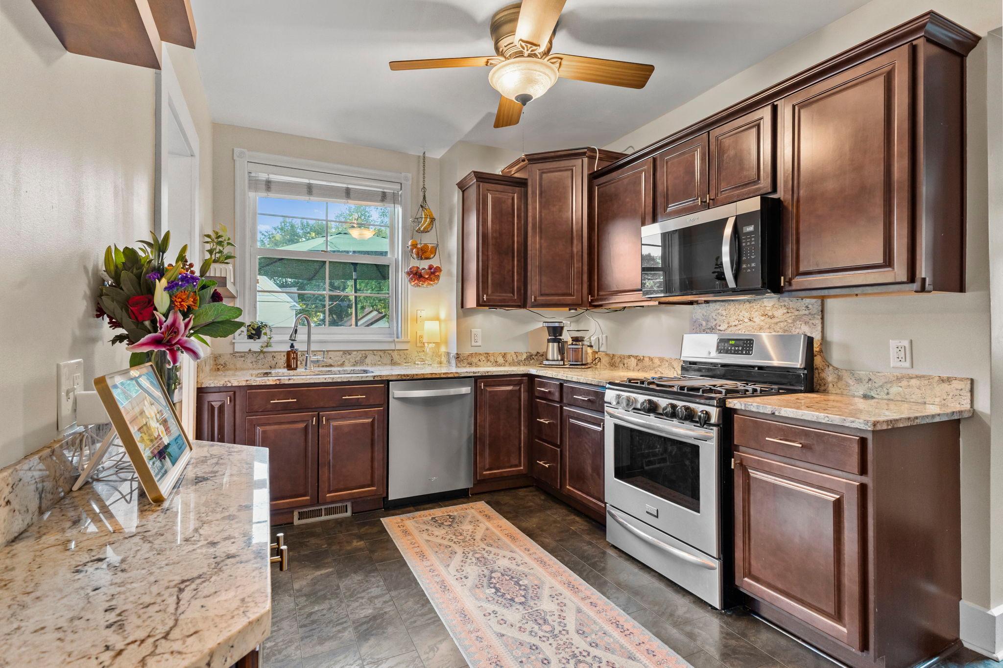 Kitchen with Cherry cabinets and Granite counters
