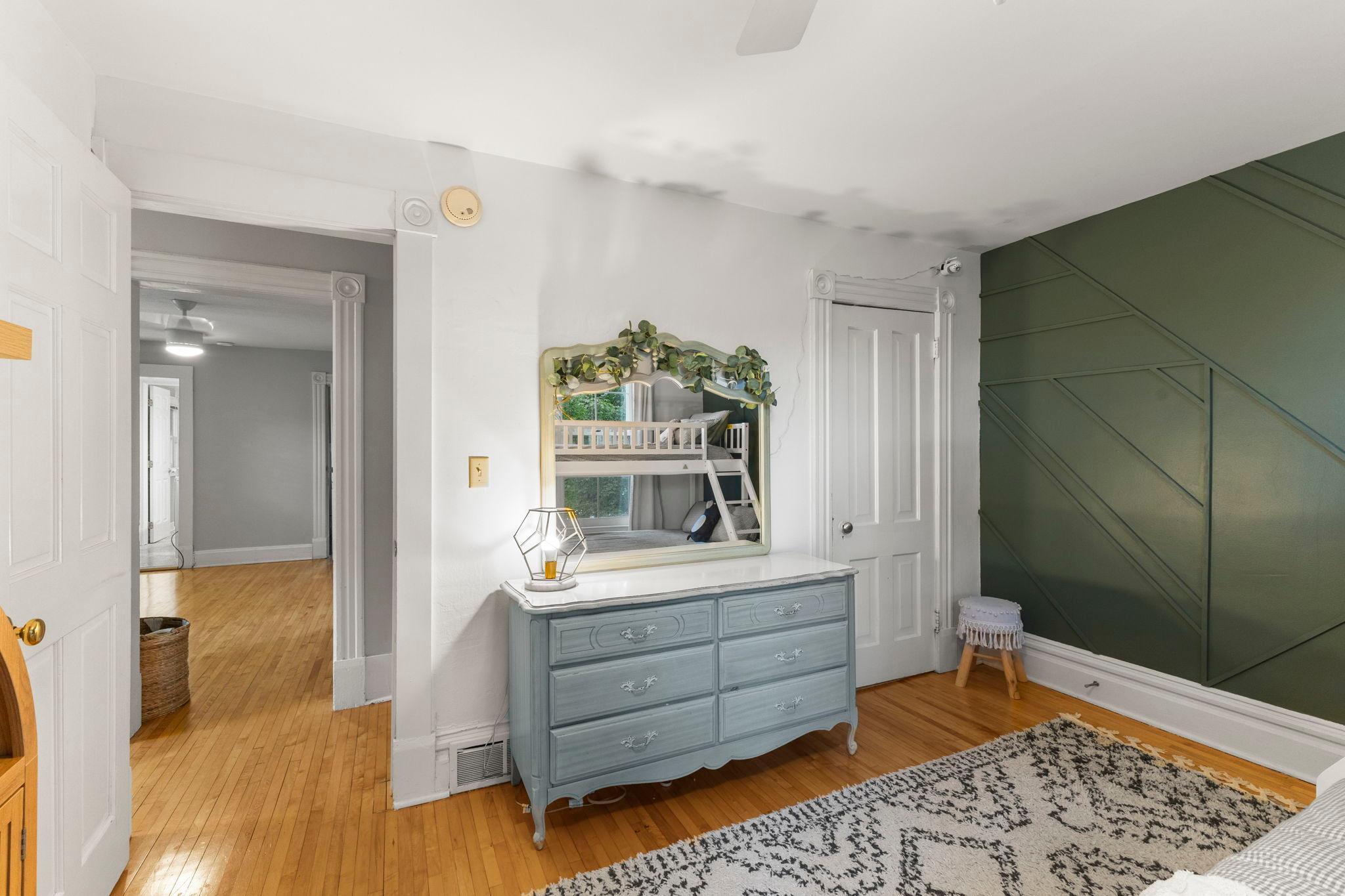 Second level bedroom featuring hardwood floors