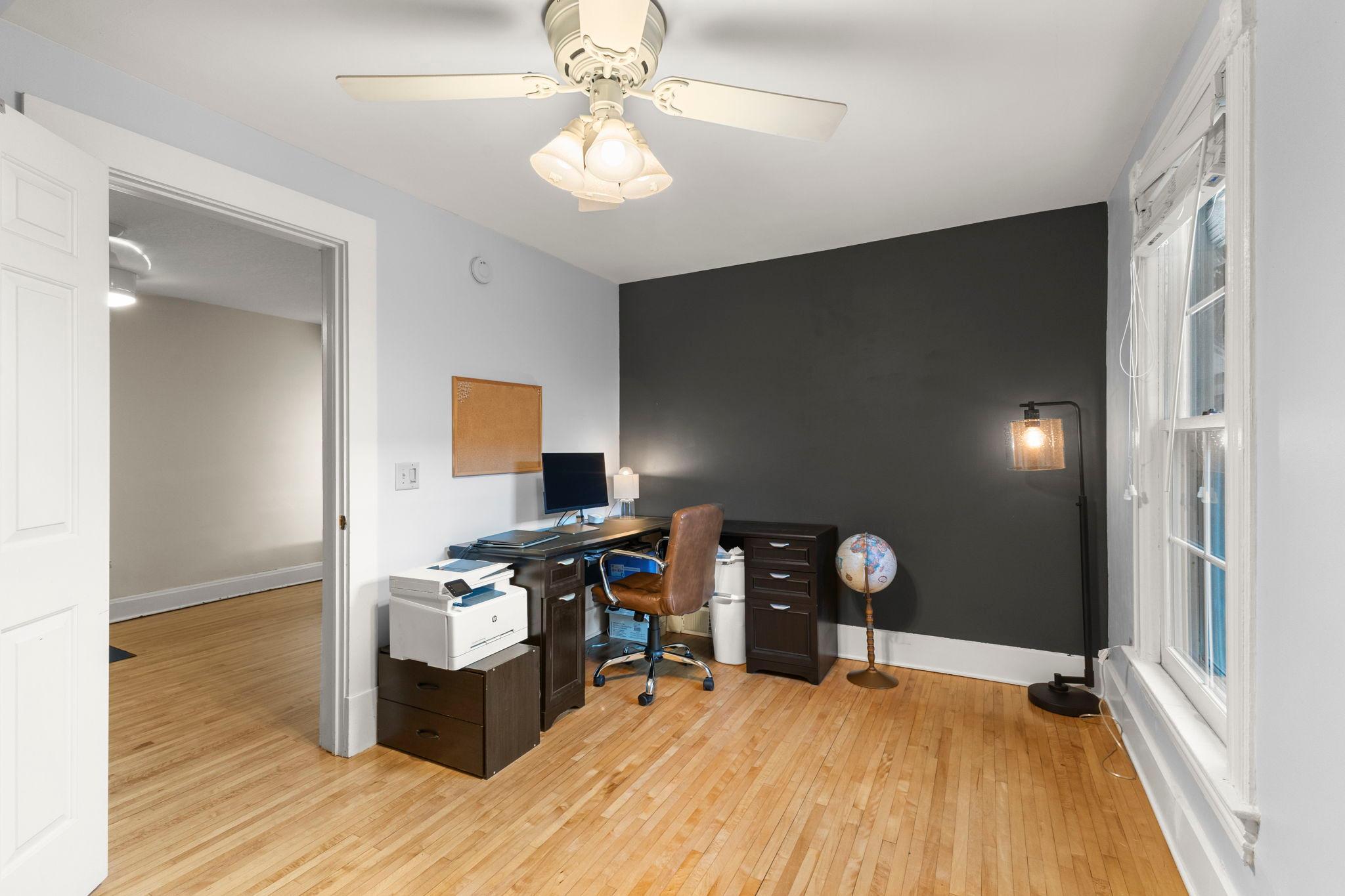 Second level bedroom featuring beautiful hardwood floors, white trim and neutral colorss