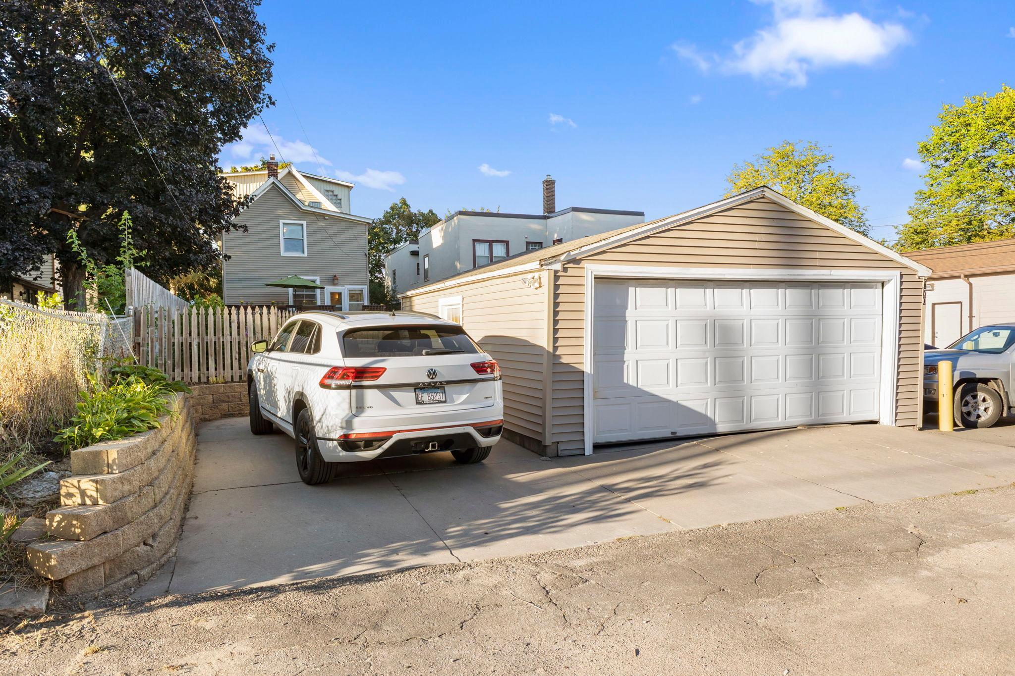 Two car detached garage with additional parking space