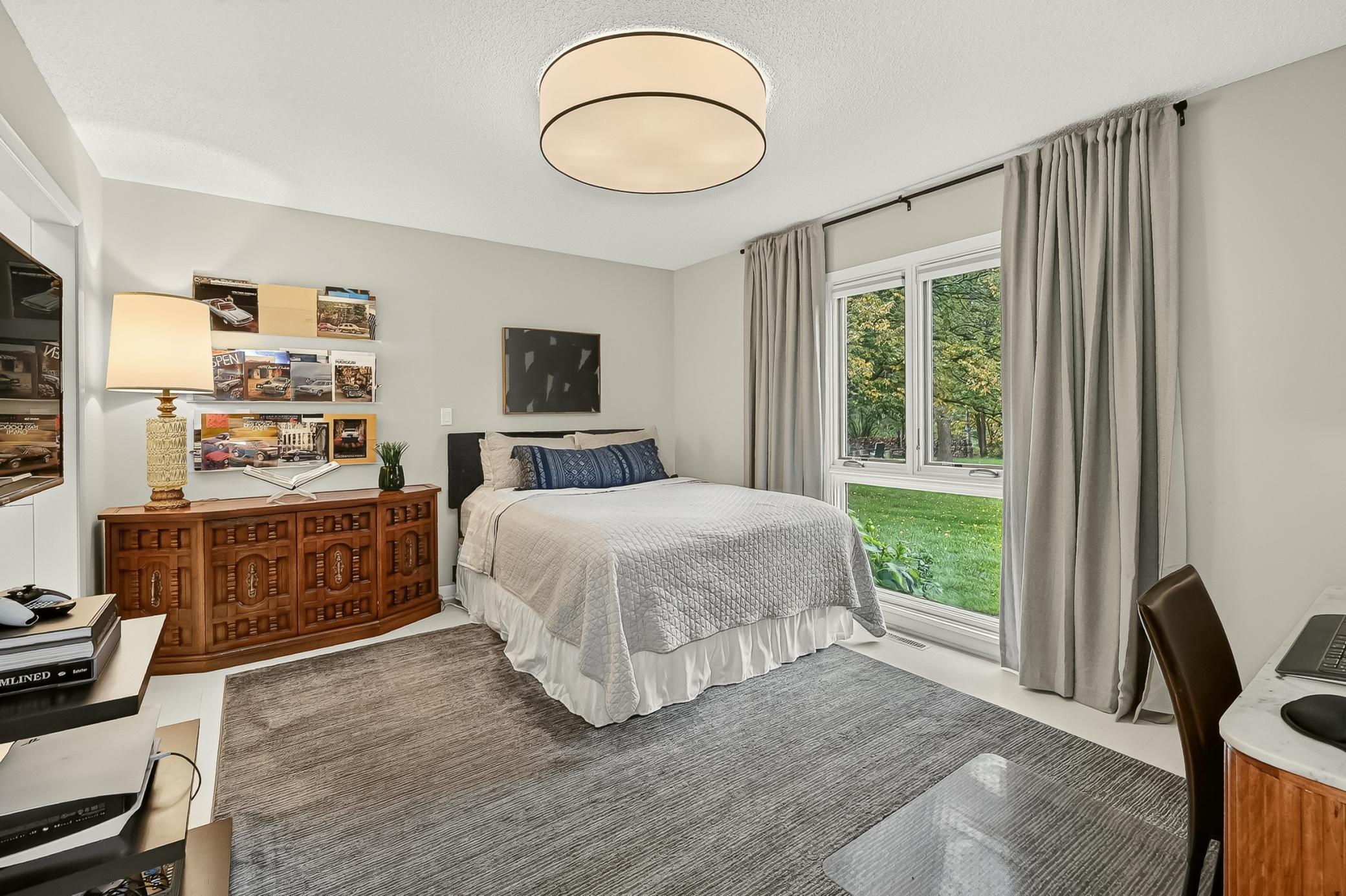 Very spacious bedroom three with new lighting and abundant natural light.