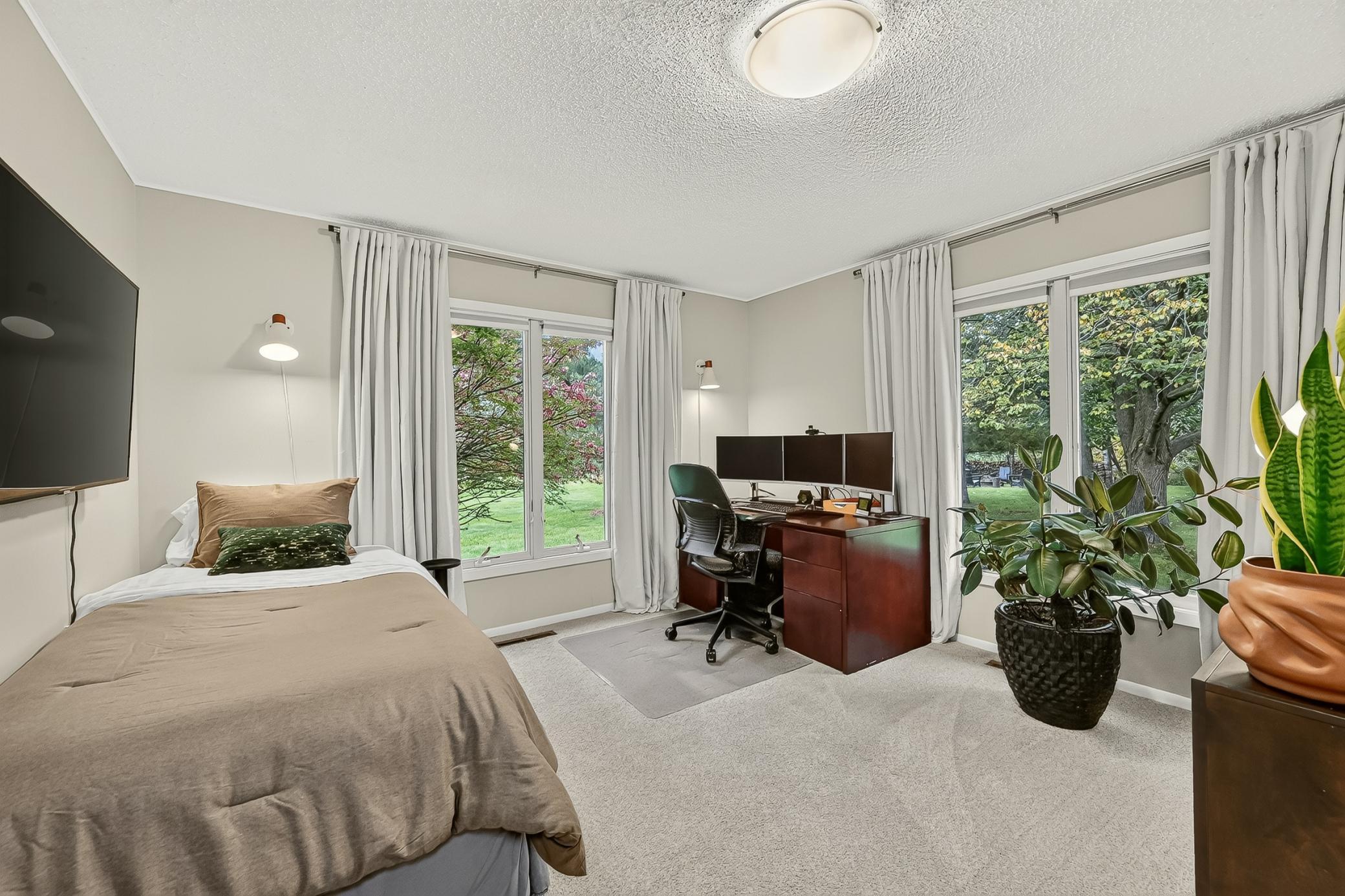 Very bright and spacious bedroom two with views of front and side yard.