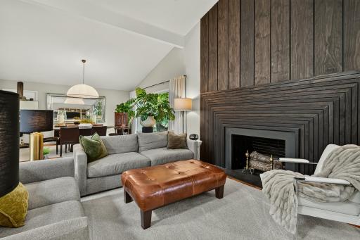 Large but cozy living room highlighted by the custom full wall fireplace surround.