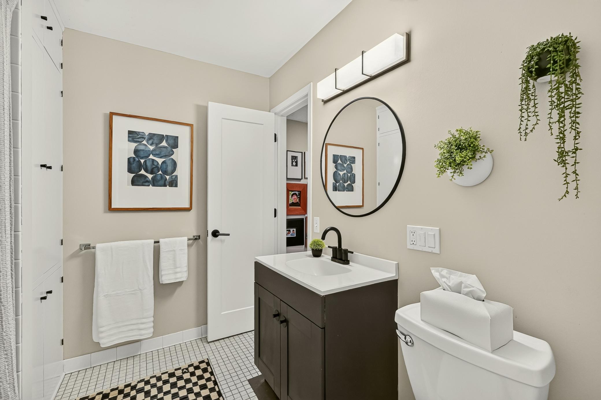 Charming second main floor full bath with abundant built in storage.