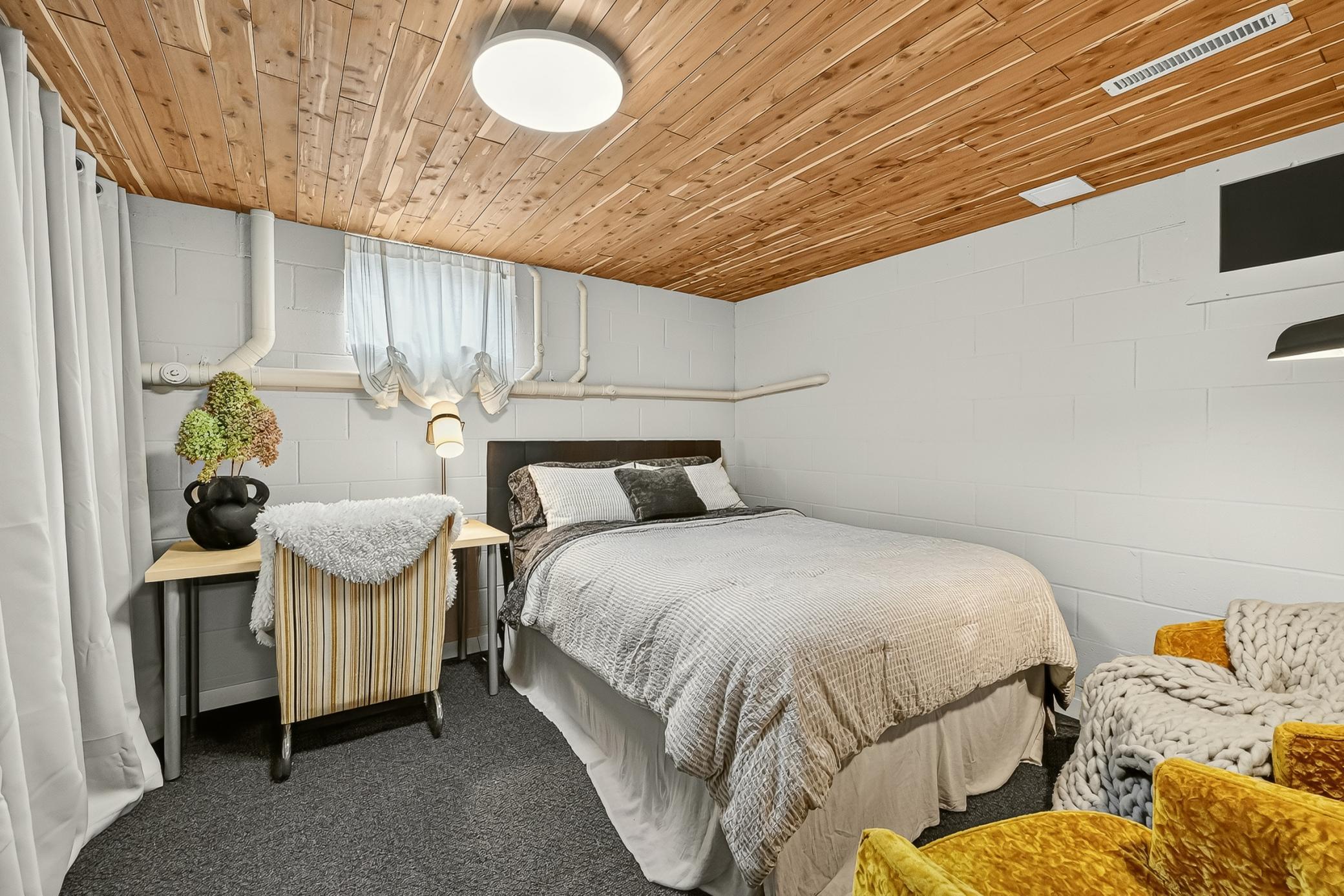 Lower-level bonus room highlighted by a new cedar ceiling has an impressive amount of concealed storage.
