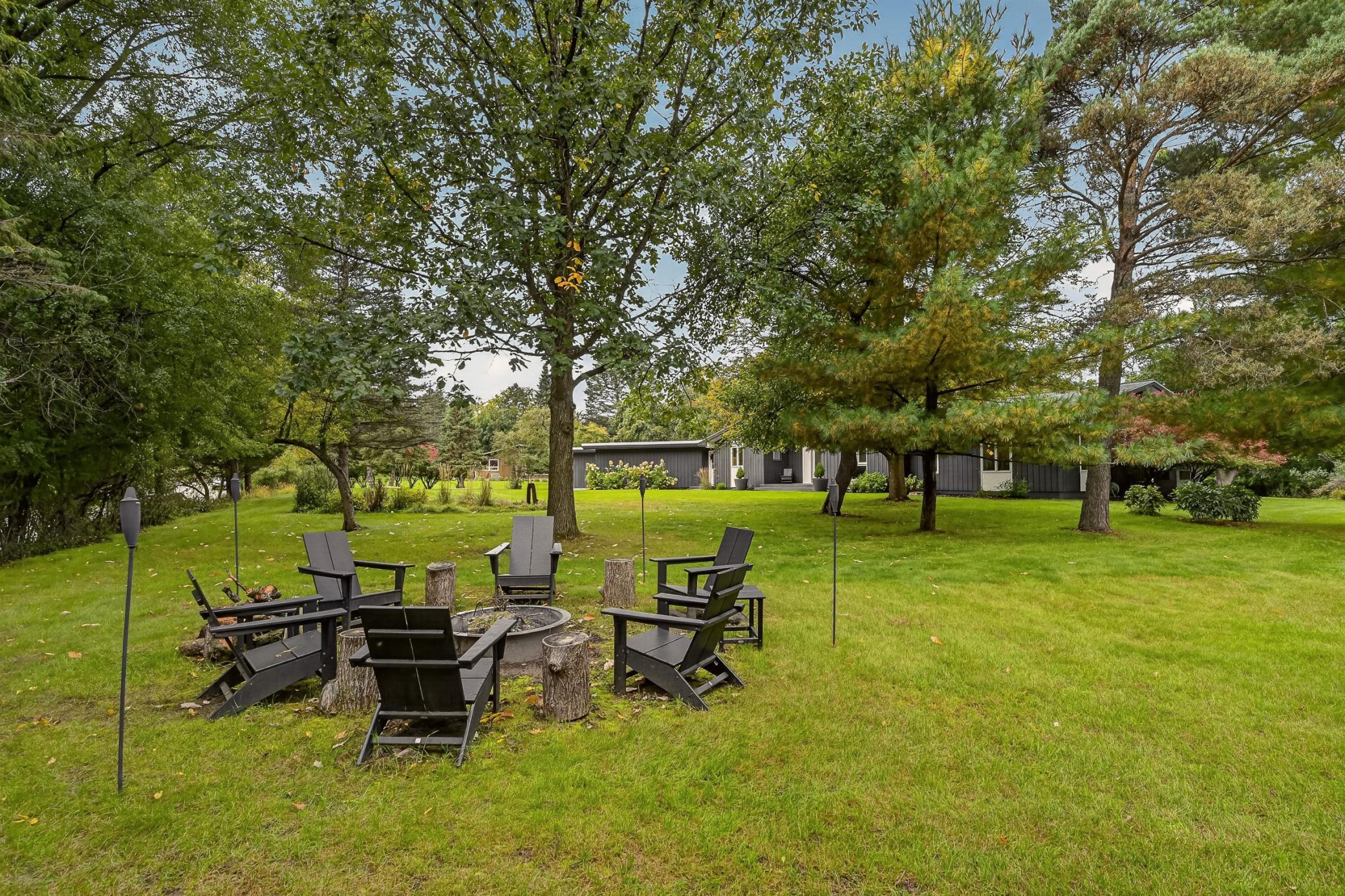 A view from across the expansive front yard showcases the beautiful setting.