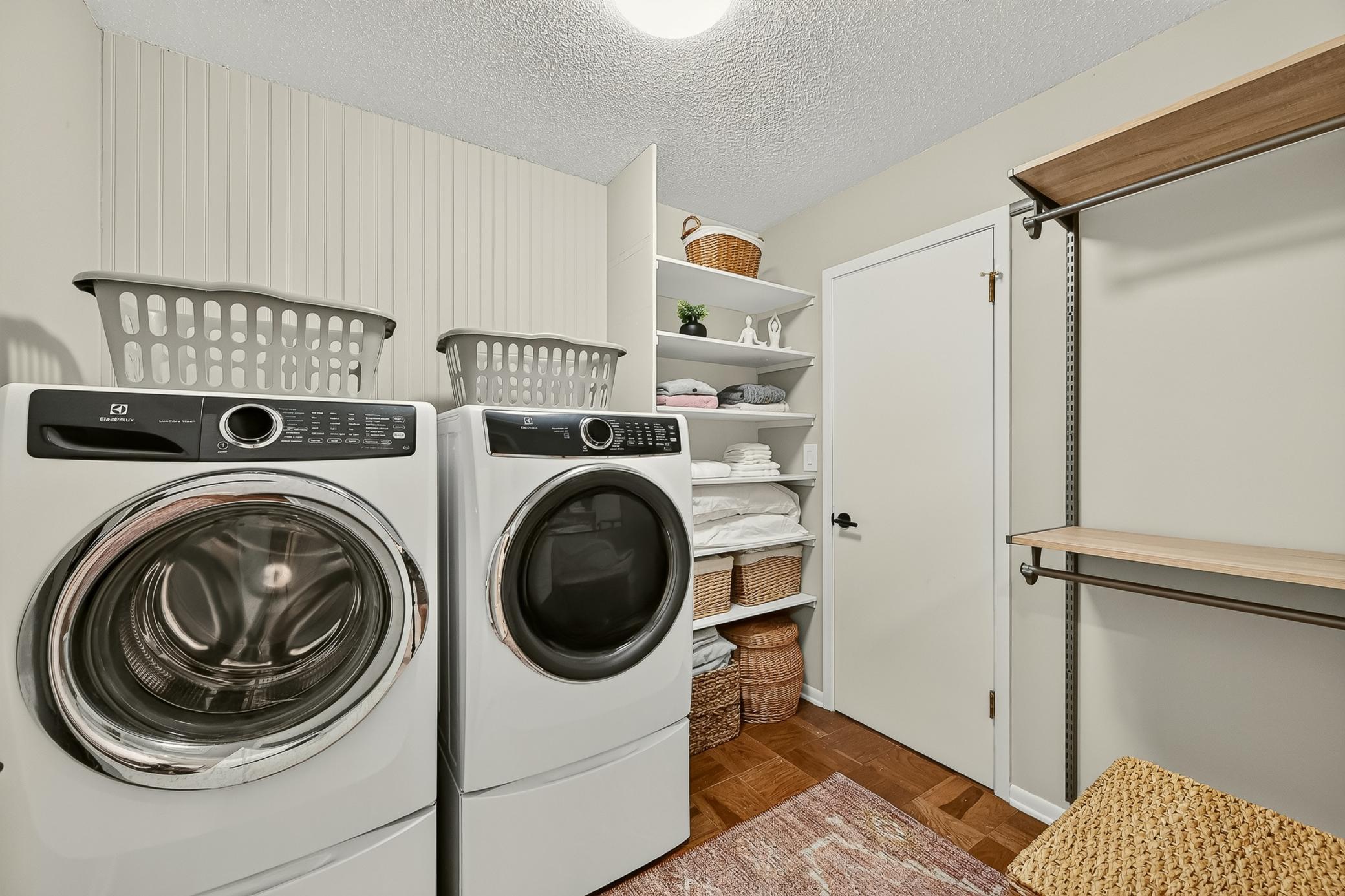 Second bedroom walk in closet doubles as the main floor laundry room (right outside of primary ensuite). There is also a wall of closets in hallway for over flow.