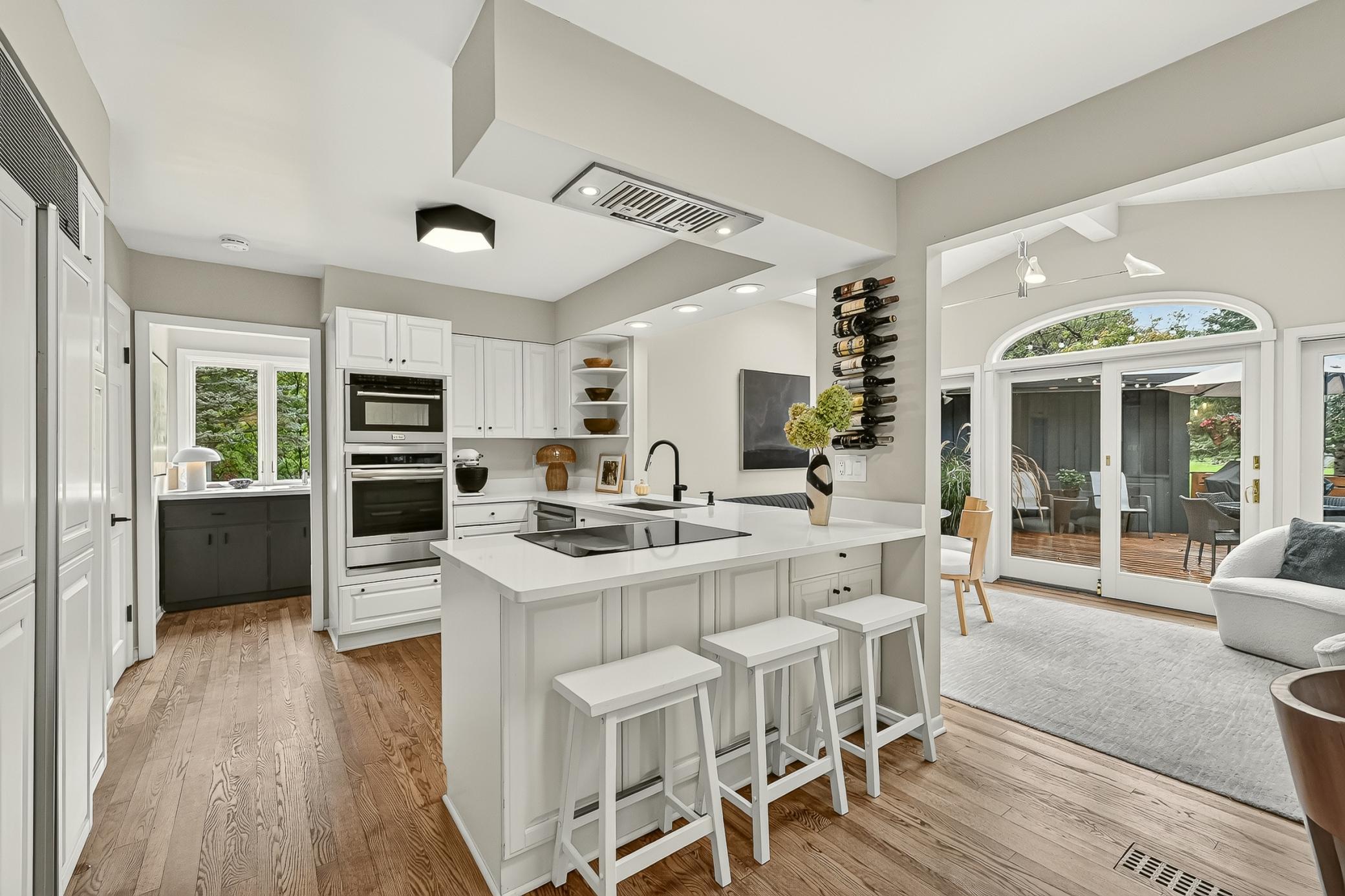 Breakfast bar and expansive eat-in kitchen with the feel of a sunroom.