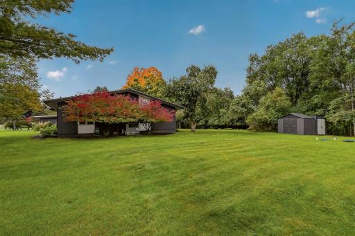 Gorgeous fall color beginning to turn and two exterior storage sheds for added convenience.