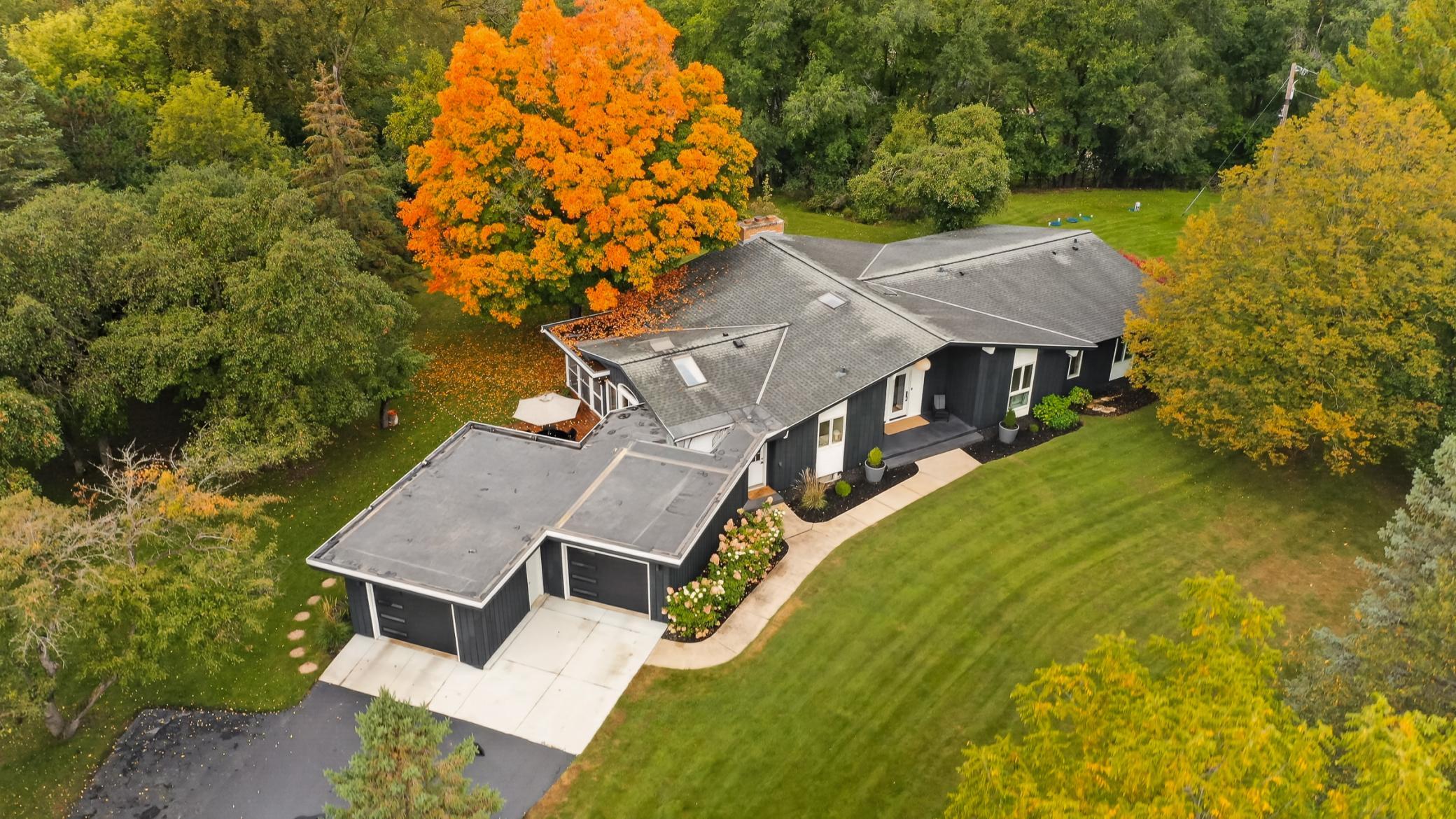 Ariel showcasing the stunning Fall color and additional parking spaces on turn around driveway.