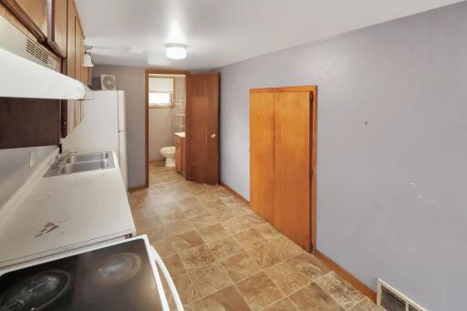 Full bath and laundry closet off the kitchen