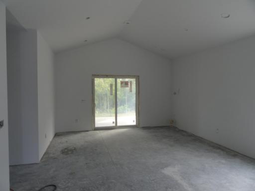 Living room, corner fireplace, patio dooe to screened porch
