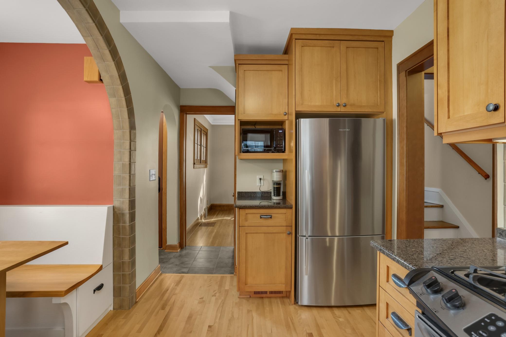 The beautifully updated kitchen is a true highlight of this gorgeous home, including custom cabinetry and stainless appliances