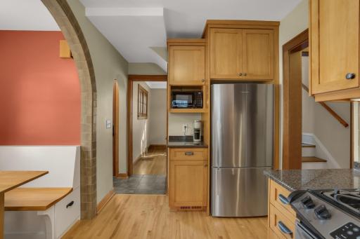The beautifully updated kitchen is a true highlight of this gorgeous home, including custom cabinetry and stainless appliances
