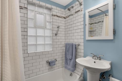 Updated main floor bathroom with beautiful tile
