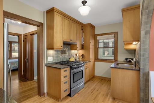 The beautifully updated kitchen is a true highlight of this gorgeous home, including custom cabinetry and stainless appliances