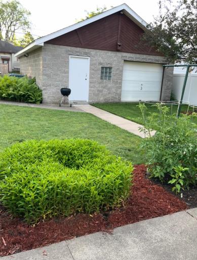 The garage also features a convenient 9 ft wide overhead door which opens into the fenced back yard.