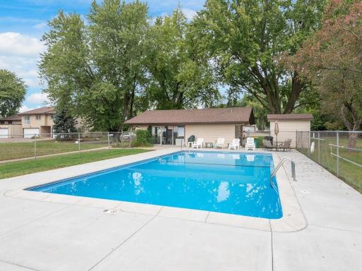 An inviting in ground pool is just steps from your back door