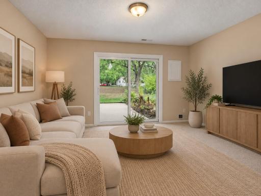 The large family room walks out to your own huge private patio - virtually staged