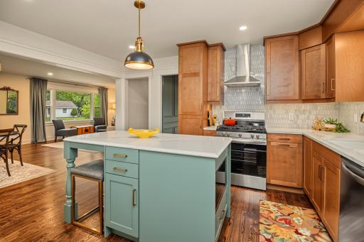Full range hood and on trend cabinets. Microwave located in center island.