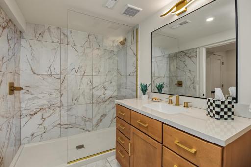 Luxury finishes seldom found at this price point. Walk-in tile shower.