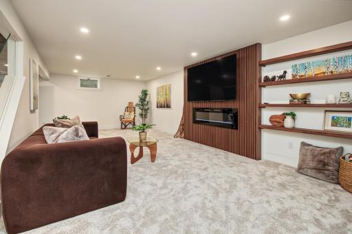 70" TV and fireplace will draw friends and family for game or movie night.
