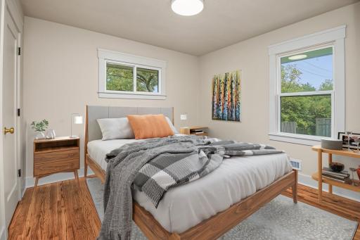 Main level secondary bedroom virtually staged.
