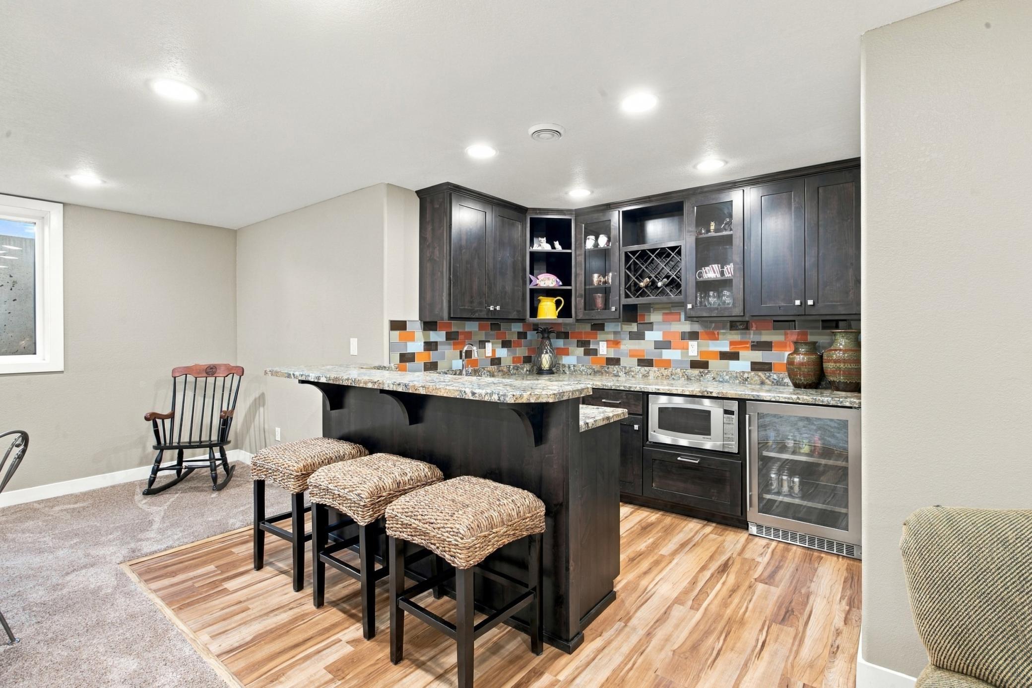 Full Bar in basement with built in microwave and beverage fridge