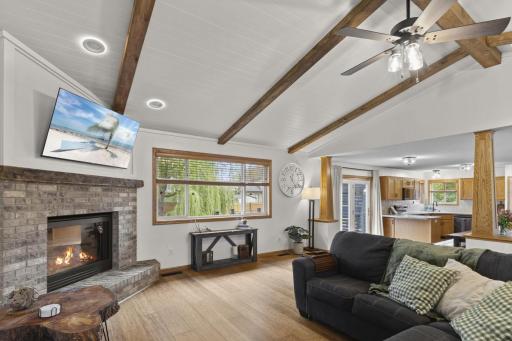 The gas fireplace with brick surround provides the perfect blend of functionality and ambiance.