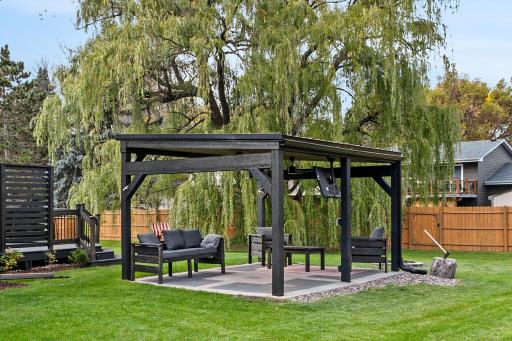 This updated and upgraded home showcases unique features, like this backyard entertainment pavilion.