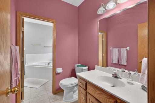 The primary bedroom has a 1/2 bath and a walk through to the main bathroom.