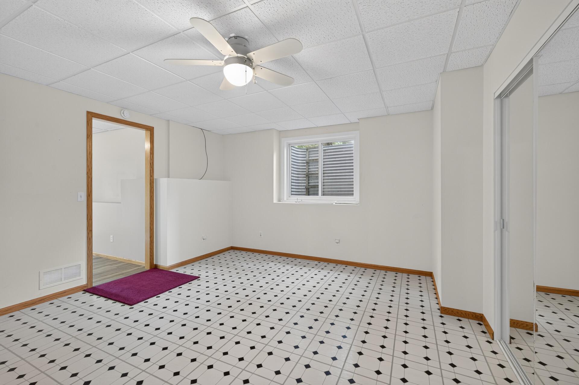 Another view of bedroom # 5 with 2 wide glider egress window for more natural light.