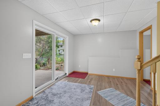 The Andersen walkout patio door to a concrete patio.