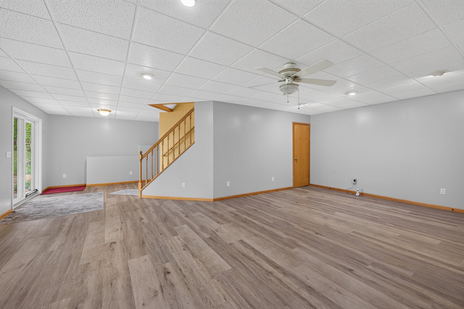 Another view of the large walkout family room with newer LVP flooring. Lots of room for the big gatherings.