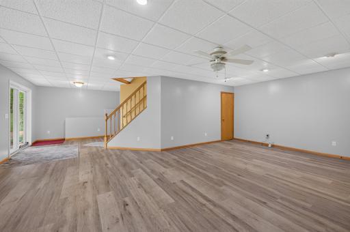 Another view of the large walkout family room with newer LVP flooring. Lots of room for the big gatherings.