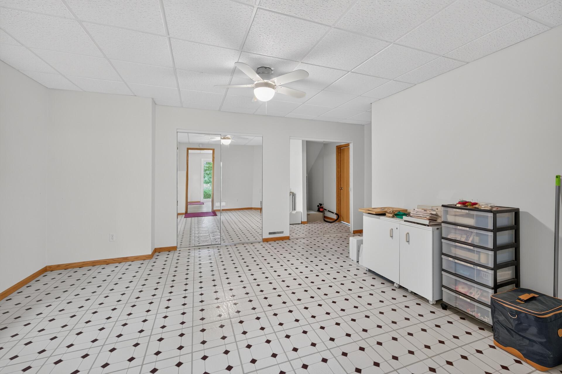 Bedroom # 5 in the basement was set up as an exercise room. It is a huge room at 18x14.