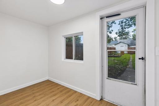Unit 1: A spacious back porch extends to the outdoor living space and provides easy access to the backyard.