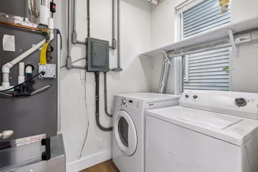 Unit 1: Laundry is right where you need it! The main-floor laundry and utility room is located just off the full bathroom.