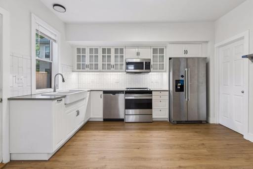 Unit 1: Access the basement through the door right off the kitchen.