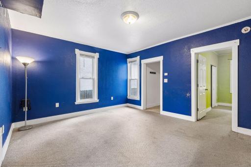 Unit 2: The living room connects seamlessly to the main-floor bedroom and kitchen, creating an easy flow throughout the main level.