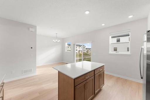 Extra center island on top of the L shape countertop for even more space