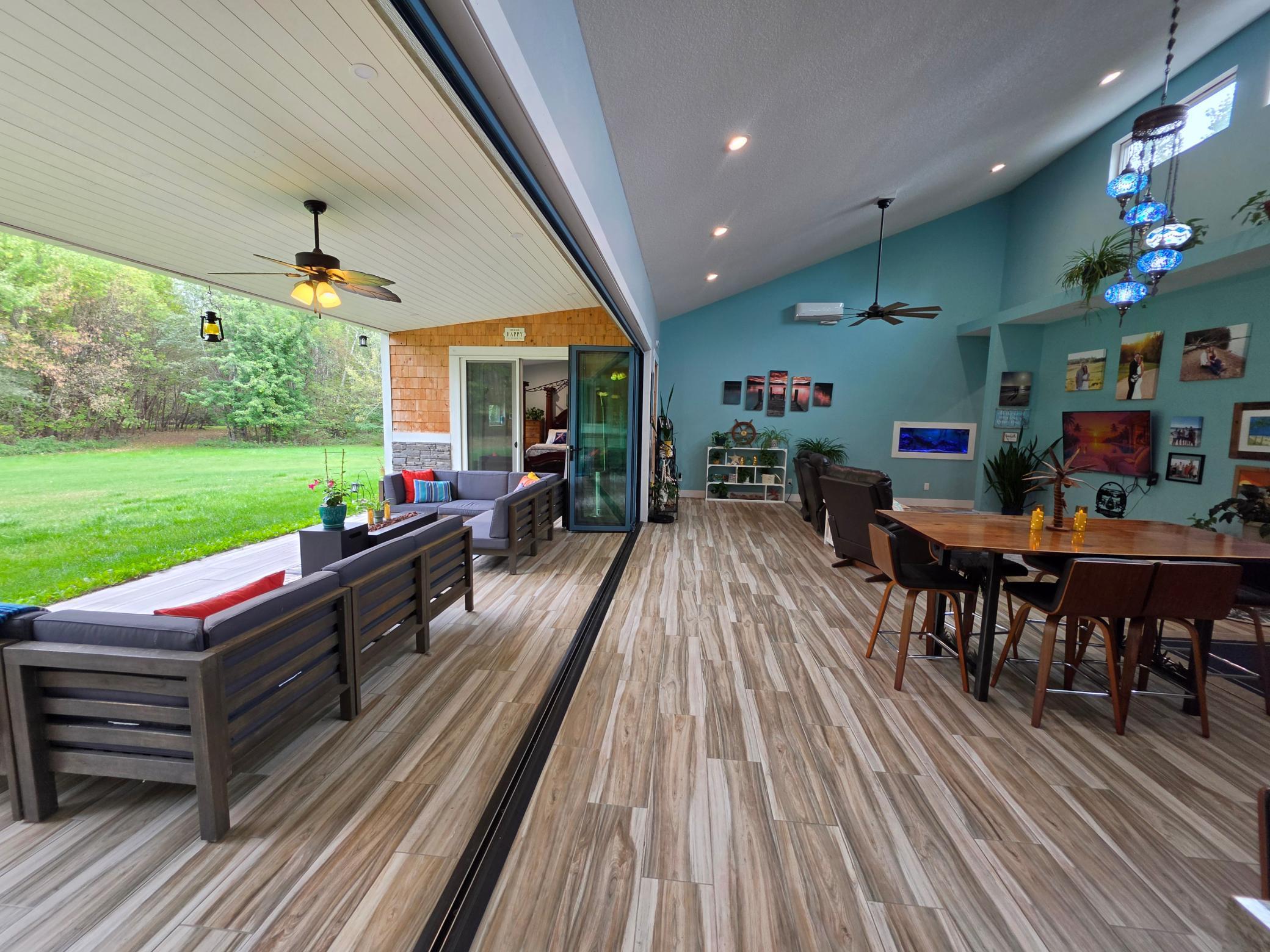 glass doors fully open to back courtyard