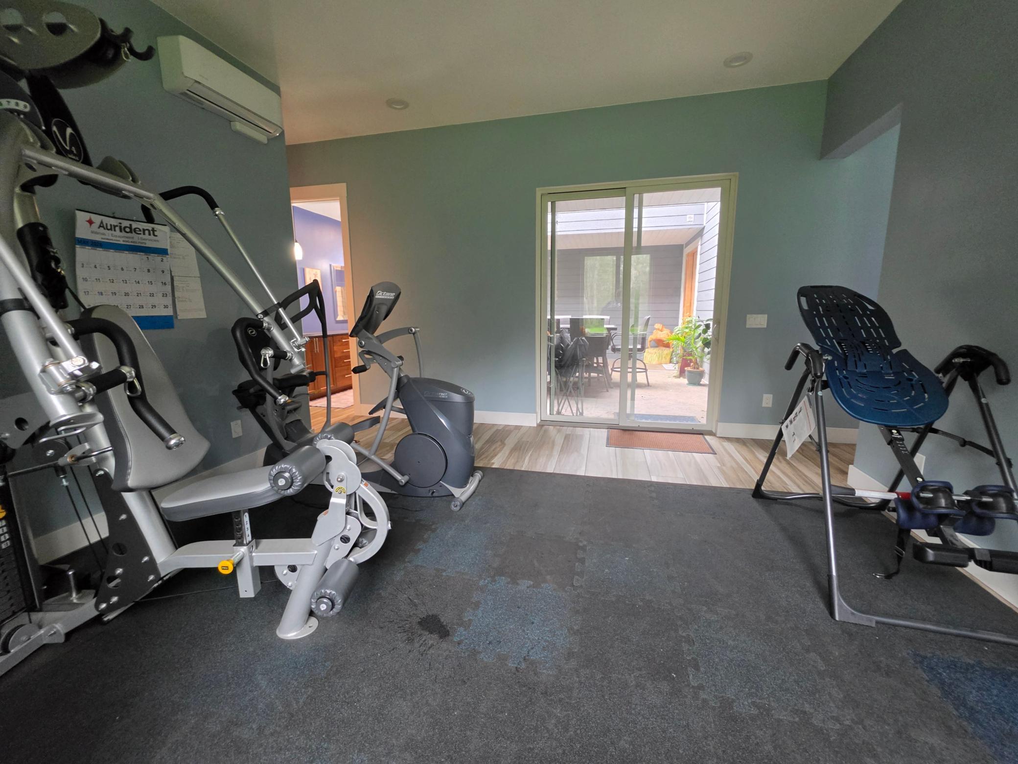 exercise room with walkout to front courtyard