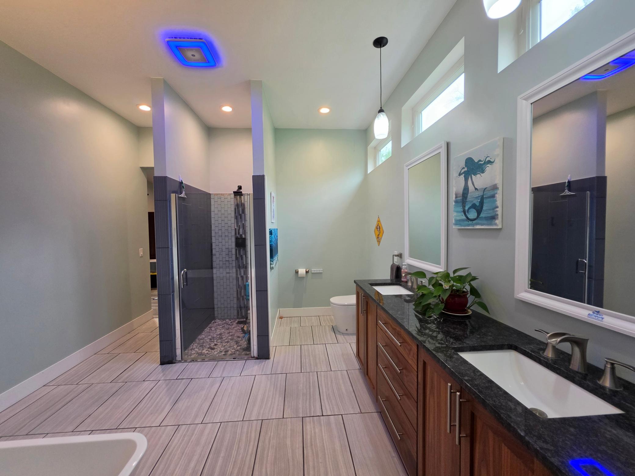 primary bath, soaking tub, stand alone shower, double sink, and luxury bidet toilet