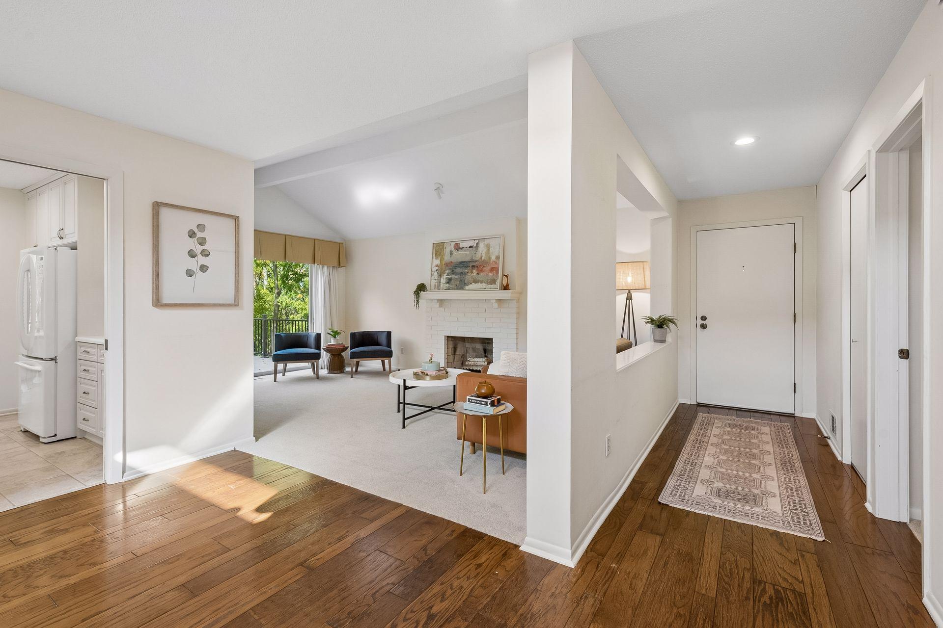 Enjoy privacy and views of nature through walls of windows facing the backyard with lush landscaping.