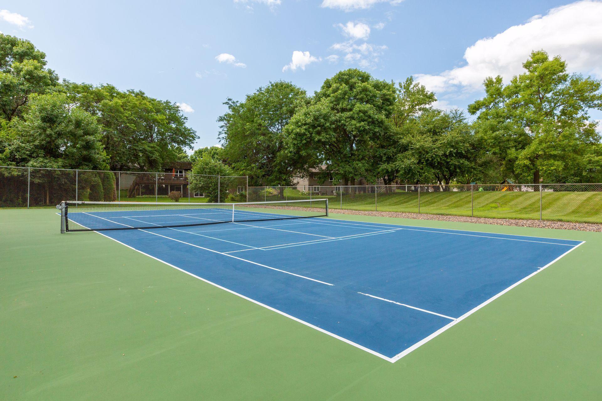 Community tennis court is conveniently located on the opposite side of the development.