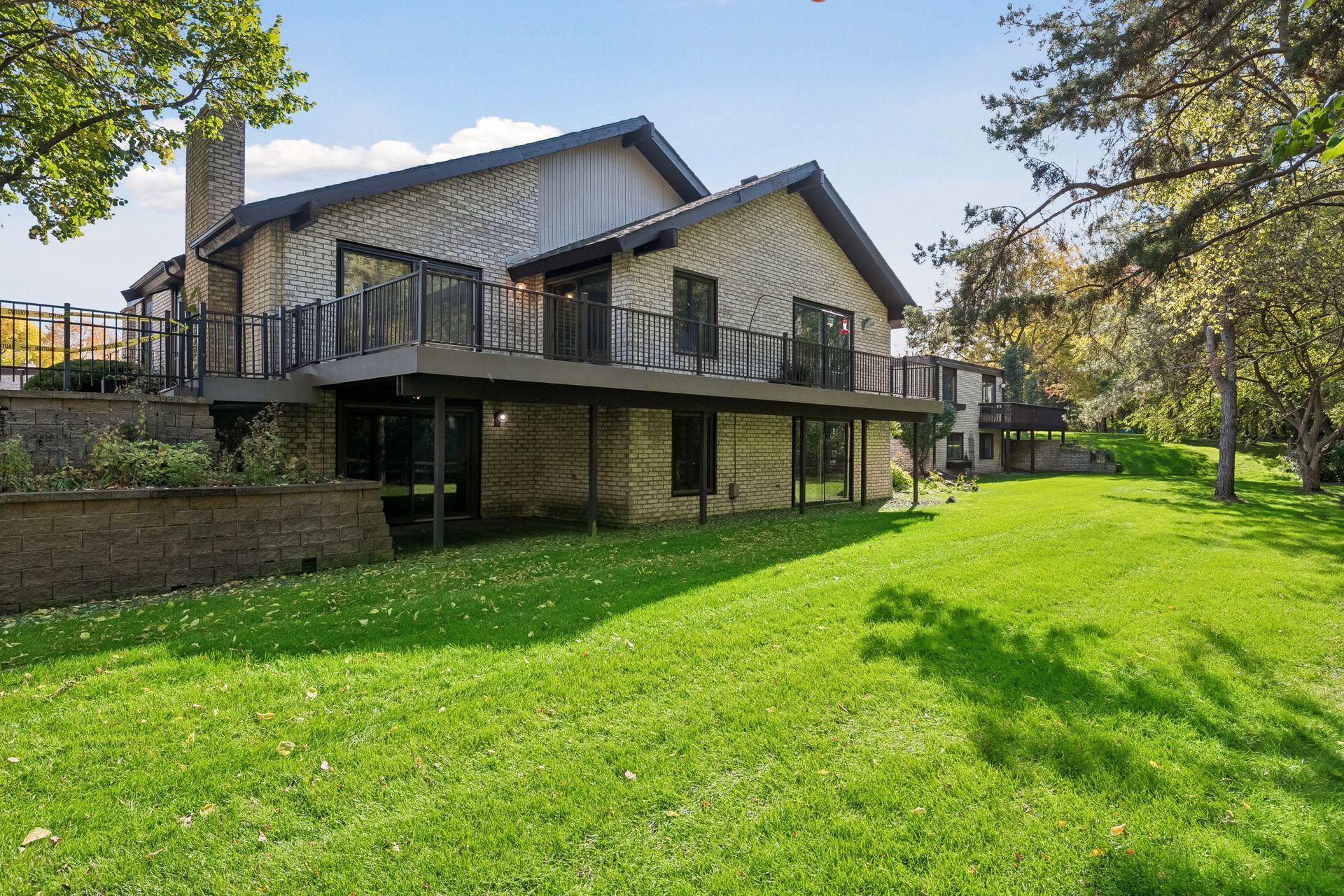 Walkout lower level opens to a private covered patio and lush backyard.